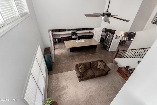 4125 W Lydia Ln, Phoenix, AZ 85041 - living room featuring ceiling fan and a high ceiling