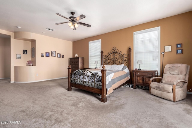 4125 W Lydia Ln, Phoenix, AZ 85041 - bedroom featuring a ceiling fan, carpet, multiple windows, and visible vents