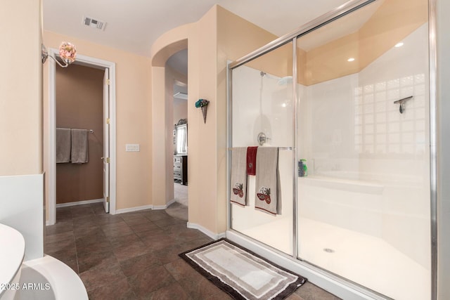 4125 W Lydia Ln, Phoenix, AZ 85041 - full bathroom with a stall shower, toilet, baseboards, visible vents, and recessed lighting