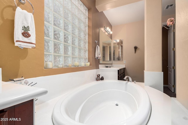 4125 W Lydia Ln, Phoenix, AZ 85041 - full bathroom with visible vents, vanity, and a garden tub