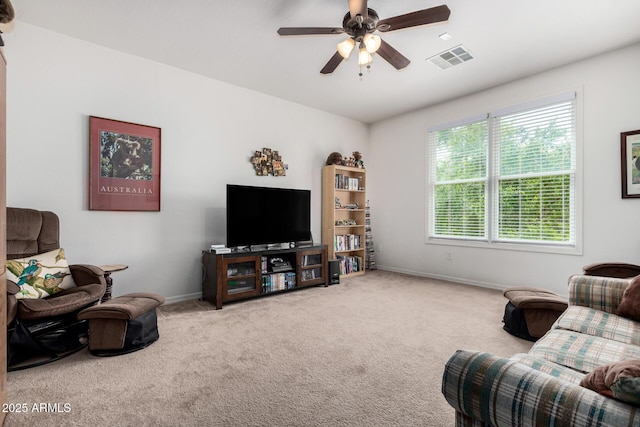 4125 W Lydia Ln, Phoenix, AZ 85041 - carpeted living area with baseboards, visible vents, and ceiling fan