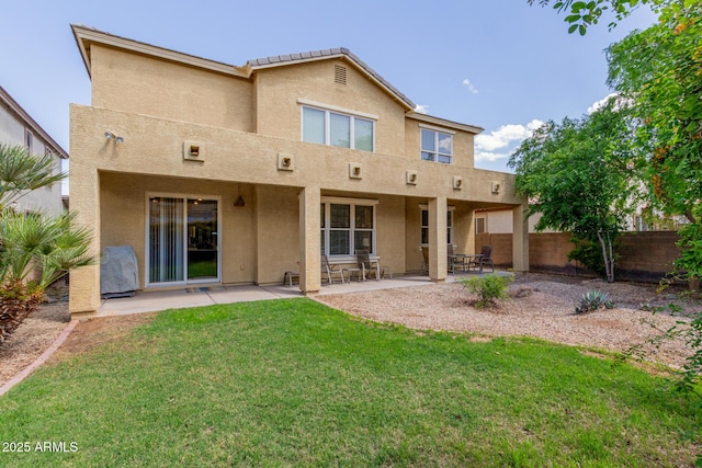 4125 W Lydia Ln, Phoenix, AZ 85041 - back of house featuring stucco siding, fence, a yard, and a patio area