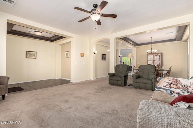 4125 W Lydia Ln, Phoenix, AZ 85041 - carpeted living area with a raised ceiling, arched walkways, and visible vents
