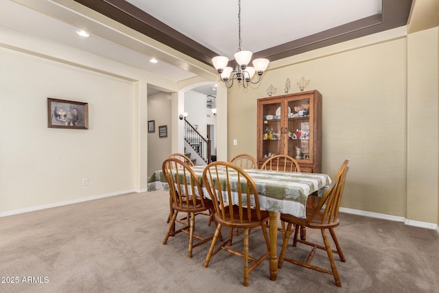 4125 W Lydia Ln, Phoenix, AZ 85041 - dining space with stairway, an inviting chandelier, baseboards, arched walkways, and light carpet