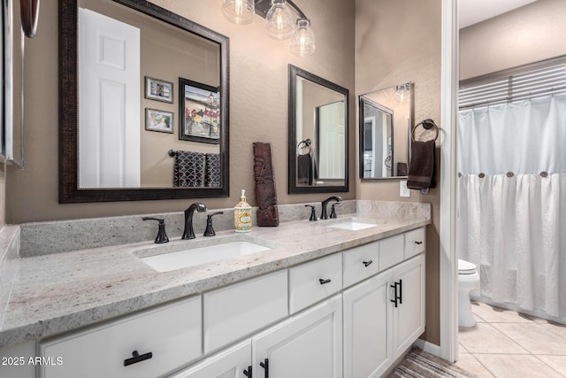 bathroom with walk in shower, tile patterned floors, vanity, and toilet