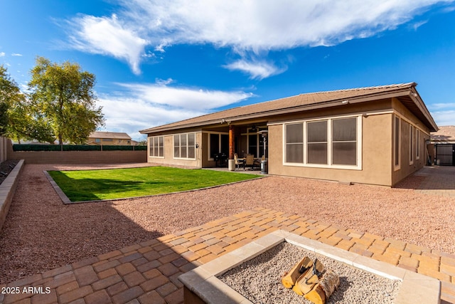 rear view of property featuring a patio area