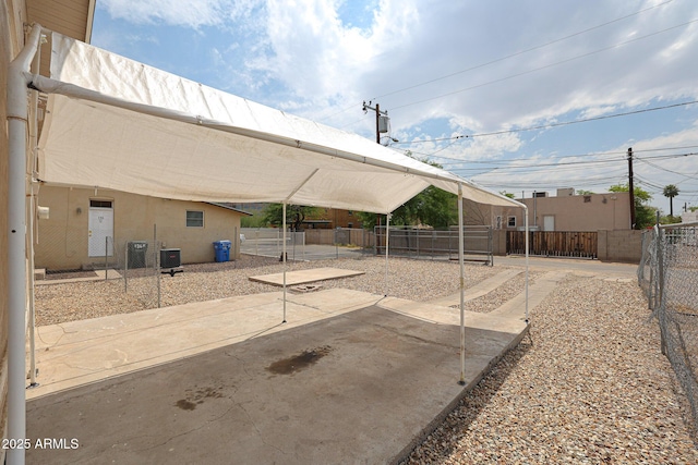 view of patio featuring cooling unit and a fenced backyard