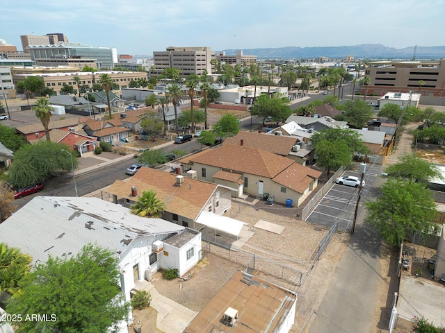 drone / aerial view featuring a view of city and a mountain view