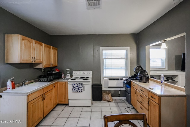 kitchen featuring light tile patterned floors, white range with electric cooktop, and sink