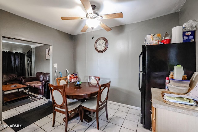 tiled dining room with ceiling fan