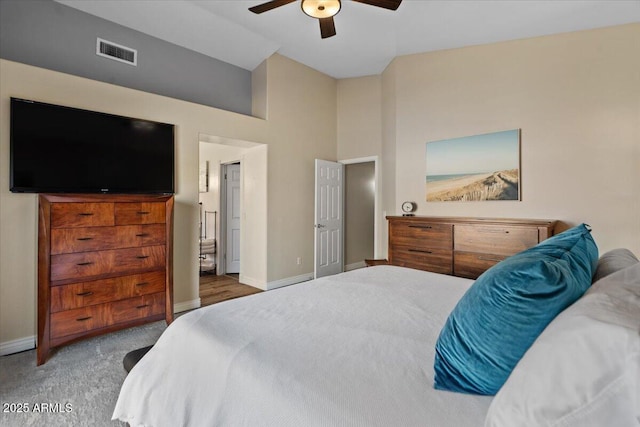 carpeted bedroom featuring baseboards, visible vents, and ceiling fan