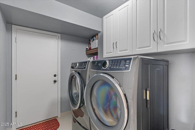 laundry area featuring cabinet space and washing machine and dryer