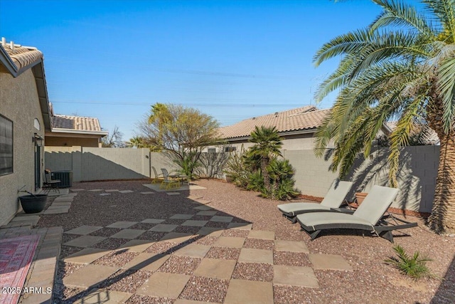 view of patio / terrace with a fenced backyard and central air condition unit