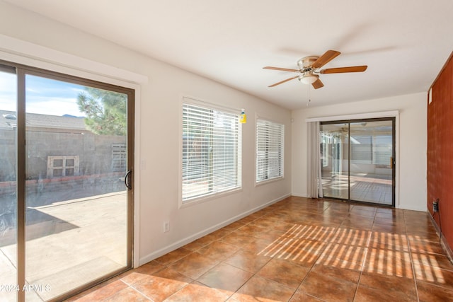 interior space featuring ceiling fan and light tile patterned flooring