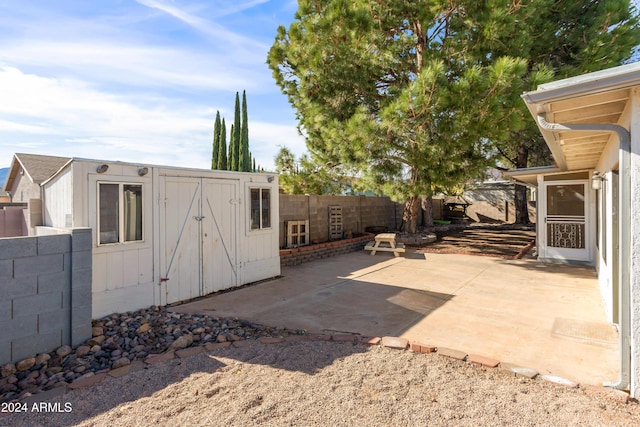 view of patio / terrace with a storage unit