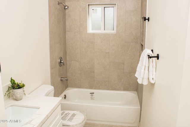 full bathroom with vanity, toilet, and tiled shower / bath combo