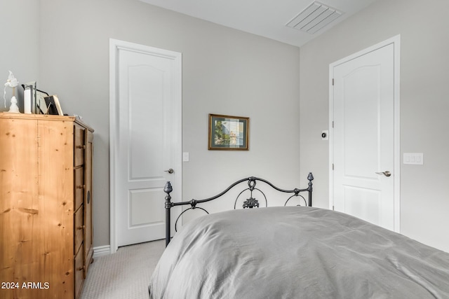 bedroom with carpet floors and visible vents