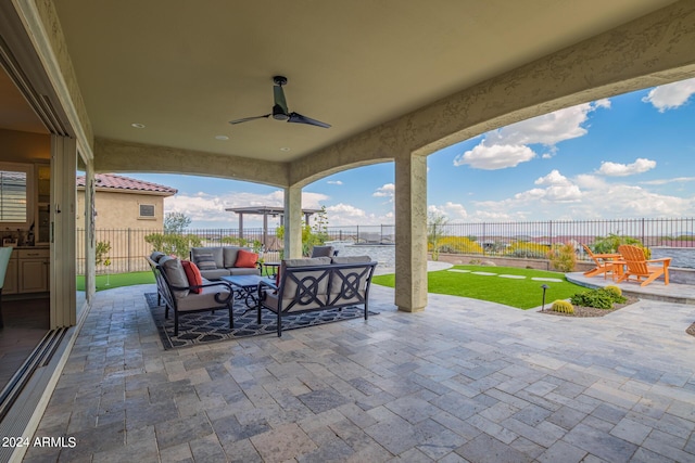 view of patio / terrace with ceiling fan, outdoor lounge area, and a fenced backyard