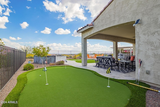 view of community with a patio and a fenced backyard