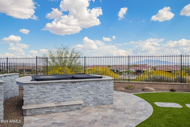 view of patio / terrace featuring fence