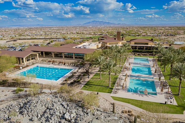 view of swimming pool featuring a mountain view