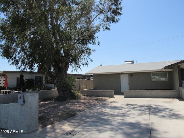 view of front of house with a patio and fence private yard