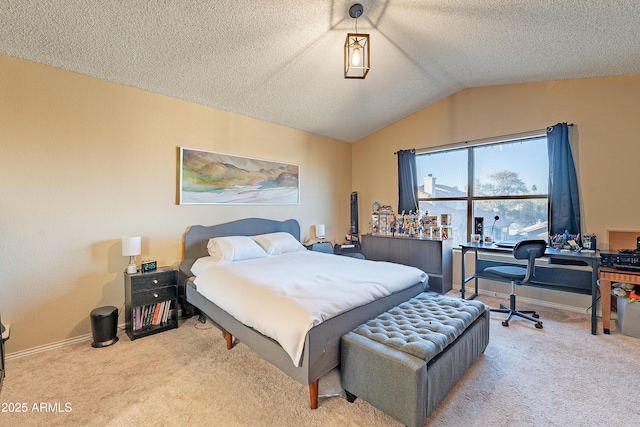 bedroom featuring a textured ceiling, lofted ceiling, and light colored carpet