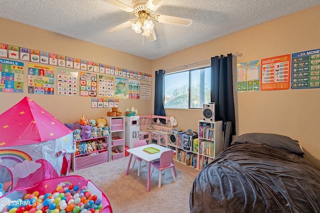 bedroom with ceiling fan, a textured ceiling, and carpet floors