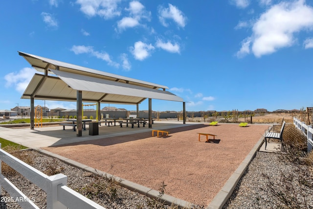 view of home's community with fence and a gazebo