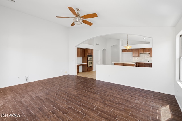 unfurnished living room featuring ceiling fan