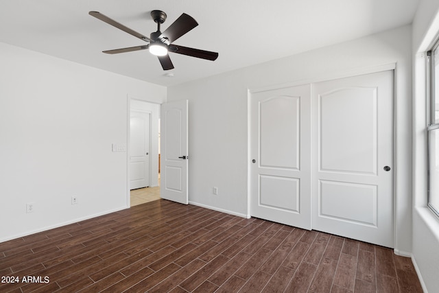 unfurnished bedroom featuring a closet and ceiling fan