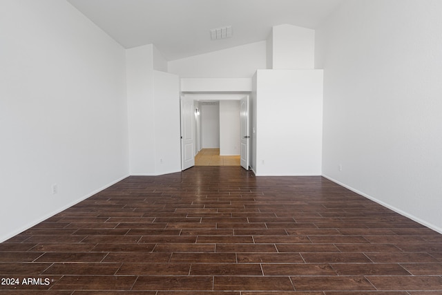 spare room featuring vaulted ceiling