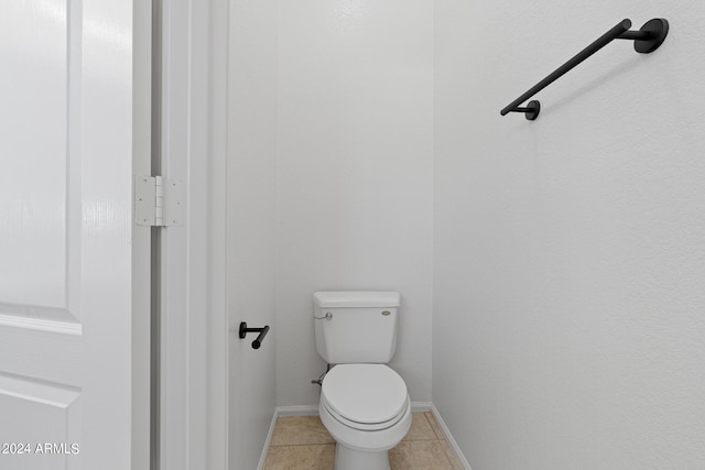 bathroom featuring tile patterned floors and toilet