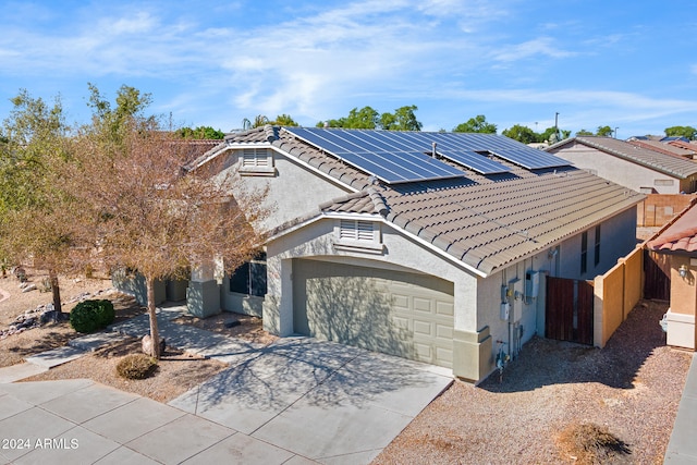 view of front of house featuring solar panels