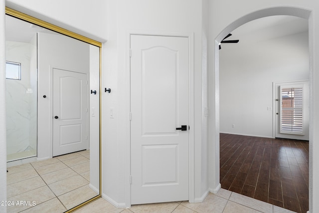 hallway featuring light tile patterned floors