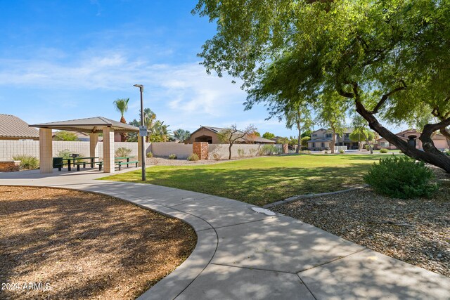 view of home's community with a gazebo and a yard