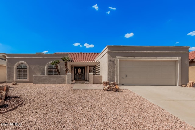 1955 Leisure World, Mesa, AZ 85206 - view of front facade featuring stucco siding, driveway, a garage, and a tiled roof