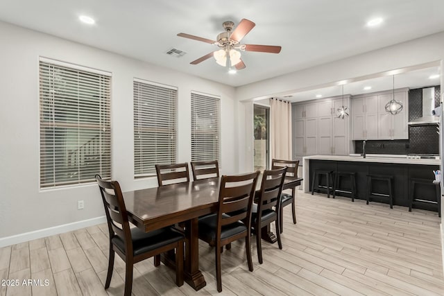 dining room with visible vents, recessed lighting, baseboards, ceiling fan, and wood tiled floor