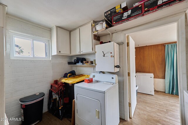 5410 E University Dr, Mesa, AZ 85205 - laundry room featuring washer / dryer, cabinet space, and light wood-style floors