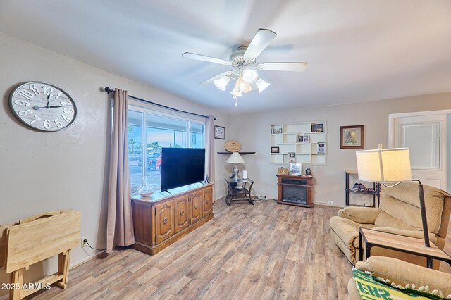 5410 E University Dr, Mesa, AZ 85205 - living room featuring light wood finished floors, ceiling fan, and baseboards