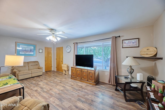 5410 E University Dr, Mesa, AZ 85205 - living room with a ceiling fan, light wood finished floors, and baseboards