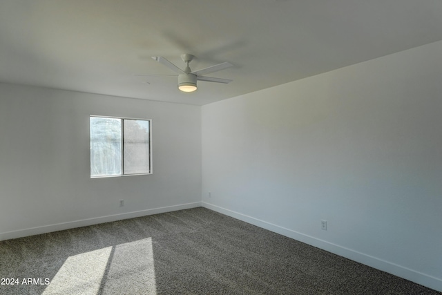 empty room featuring carpet and ceiling fan