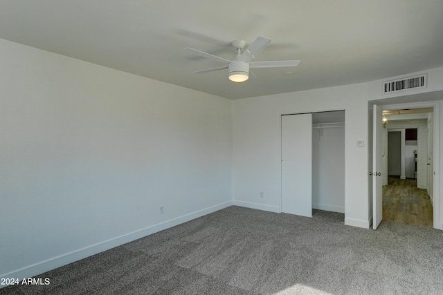 unfurnished bedroom with carpet floors, a closet, and ceiling fan