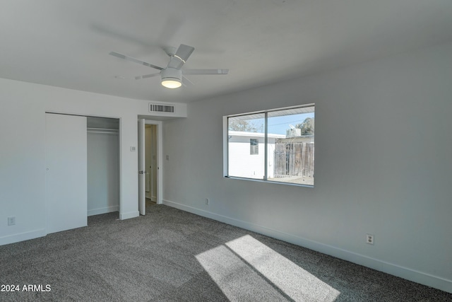 unfurnished bedroom featuring carpet flooring, ceiling fan, and a closet