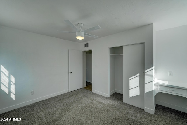 unfurnished bedroom featuring ceiling fan, carpet floors, and a closet