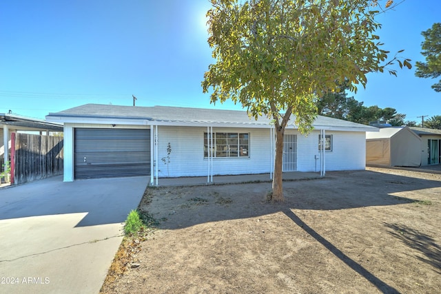 ranch-style house featuring a garage