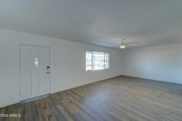 foyer entrance featuring light wood-type flooring and ceiling fan