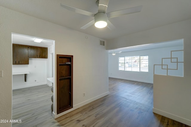 spare room with ceiling fan and light hardwood / wood-style floors