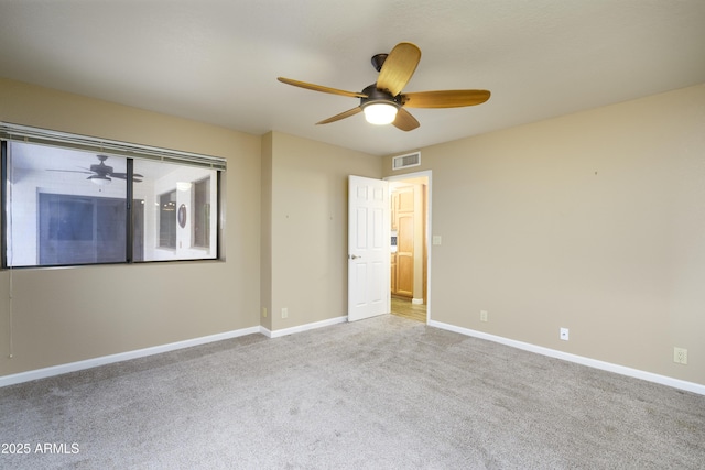 8230 E Navarro Ave, Mesa, AZ 85209 - unfurnished bedroom featuring carpet floors, baseboards, and ceiling fan