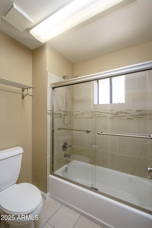 8230 E Navarro Ave, Mesa, AZ 85209 - bathroom with toilet and enclosed tub / shower combo